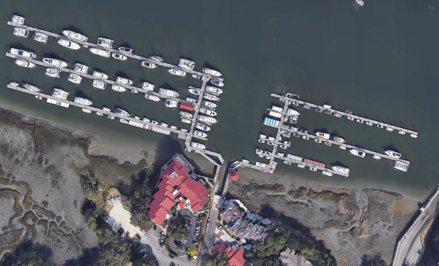 Aerial satellite overview of Palmetto Bay Marina showing docks, moored boats, and the red-roofed marina building